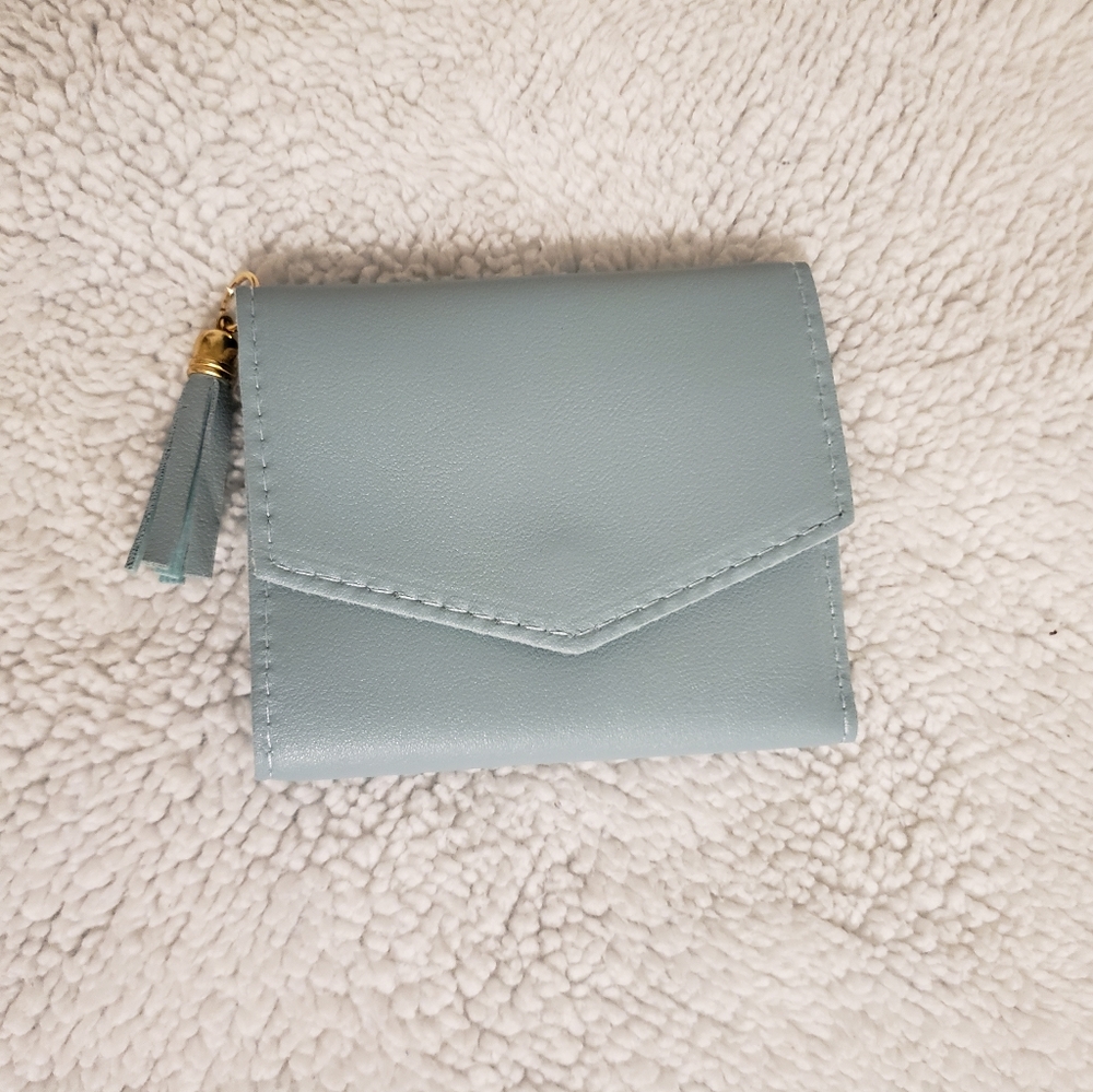 Solid tassel fold over purse
